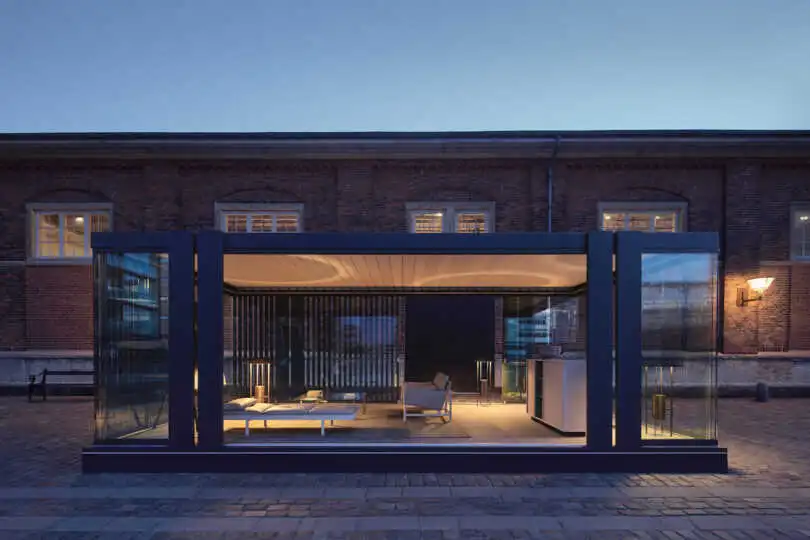 Evening view of glass structure with integrated LED glow