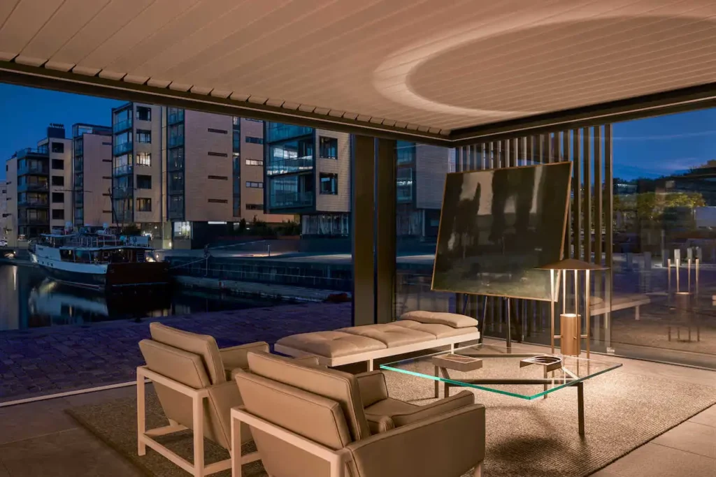 Nighttime interior with warm LED floor lamp accents