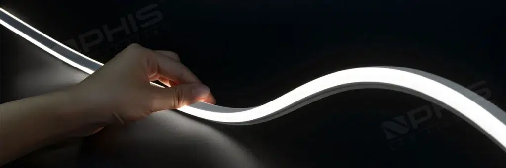 Flexible COB LED strip light being bent and held in hand, showcasing its bendability and uniform light emission for NPHIS LED Lighting » led strip light Production R&D Manufacturer|NPHIS Flexible COB LED strip light being bent and held in hand, showcasing its bendability and uniform light emission for NPHIS LED Lighting