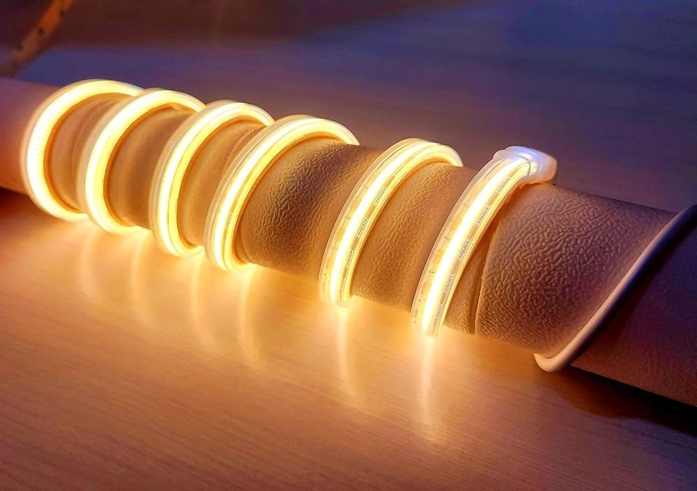 Close-up of uniform dot-free COB LED strip light rolled and glowing evenly