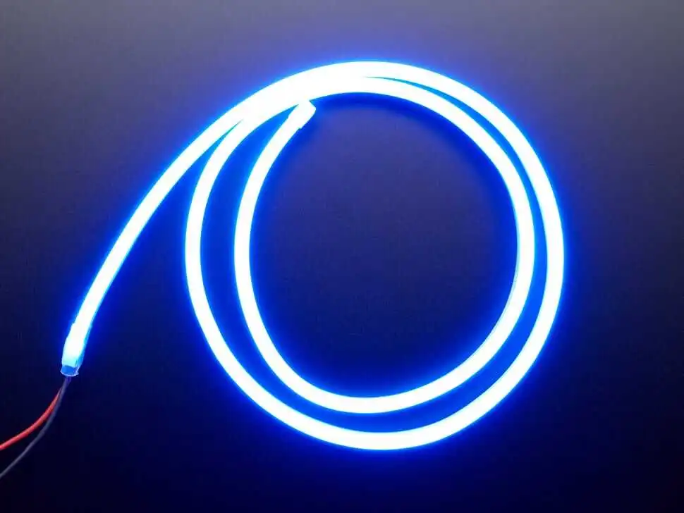 Blue silicone LED neon flex strip light coiled showing flexible silicone housing and uniform continuous glow for architectural and decorative lighting