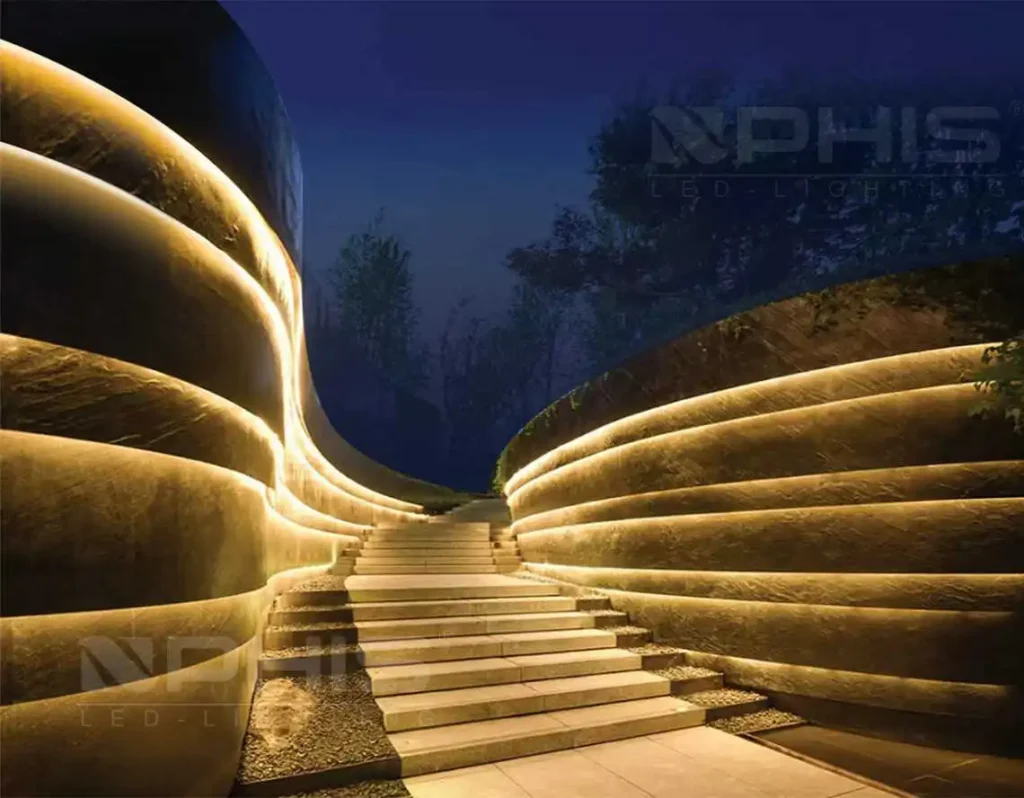 Outdoor perimeter LED strip lighting continuous run on modern building at night