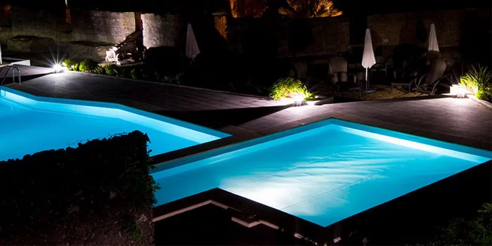 IP68 waterproof LED strip lights installed underwater in a swimming pool, creating blue ambient lighting