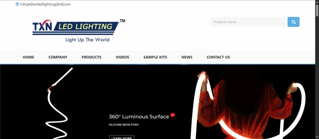 TXN LED Lighting logo with navigation bar and search field above a dark hero image showing a person shaping illuminated neon tubes.