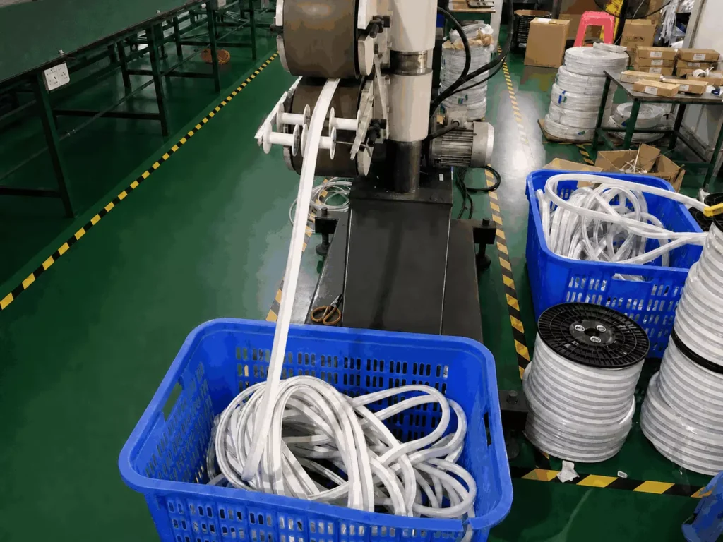 factory-extrusion-production-process-of-addressable-led-neon-flex » Custom LED Strip Lights Manufacturer | Silicone Neon Flex Supplier China Workshop production line showing silicone extrusion manufacturing process of raw addressable LED neon flex pixel lighting products