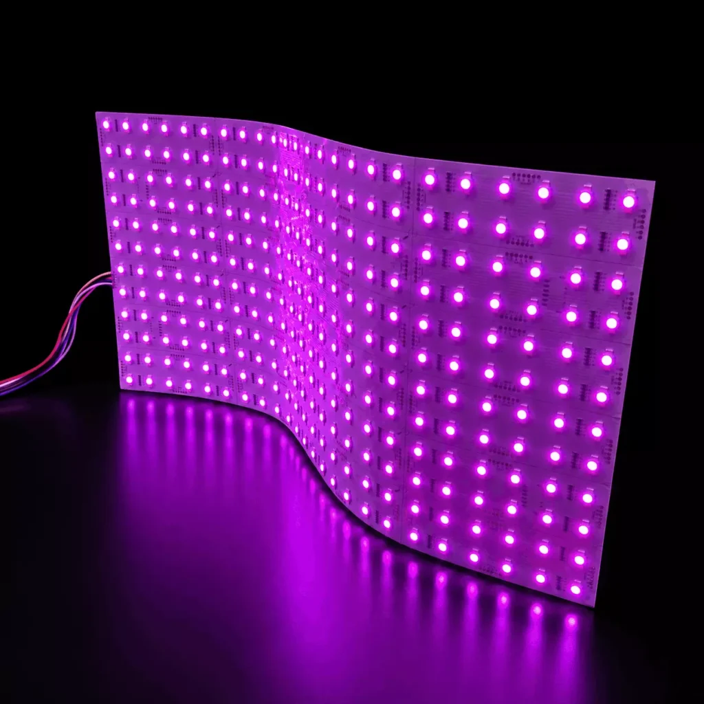 RGB SMD5050 cuttable flexible LED light sheet bent into an L-shape and glowing purple, showing uniform 480x240mm modular backlight panel for indoor decorative lighting and advertising light boxes.