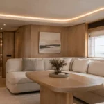 Yacht cabin interior with LED neon flex cove lighting along ceiling, soft warm indirect accent lighting for luxury yacht saloon